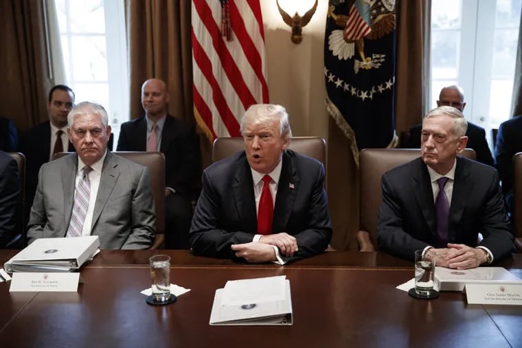 Secretary of State Rex Tillerson, left, and Secretary of Defense Jim Mattis, right, listen as President Donald Trump speaks during a cabinet meeting at the White House, Wednesday, Jan. 10, 2018, in Washington. (AP Photo/Evan Vucci)