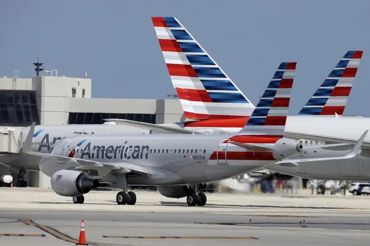 An American Airlines jet taxis to the gate at Miami International Airport.