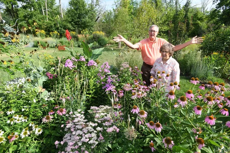 Thom and Mary Jane Mrazik show off their expansive garden, which features bee balm, white and pink phlox, lavender joe pye weed, red zinnias, and yellow cup plants.