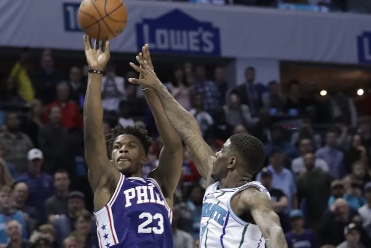 Sixers star Jimmy Butler shoots the game-winning jumper against the Hornets on Saturday.