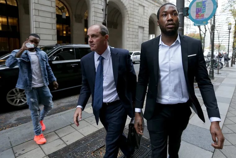 Rapper Meek Mill, right, arrives the Criminal Justice Center with his lawyer Brian McMonagle, center, in Philadelphia, PA on November 6, 2017.