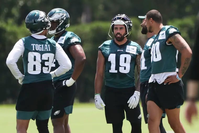 Eagles’ tight end J.J. Arcega-Whiteside (19) with his teammates during OTAs at the NovaCare Complex in June.