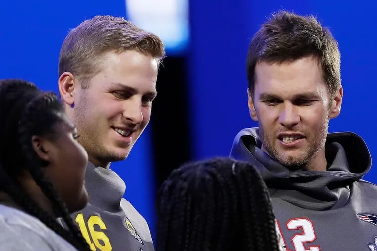 The Rams' Jared Goff (second from left) and Patriots' Tom Brady speaking with youngsters during Super Bowl week.