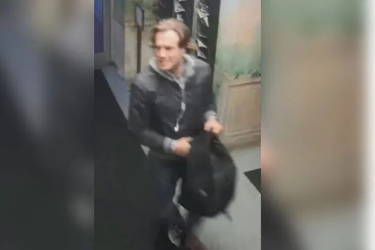 Police are seeking to identify this man, seen here at the Dorchester Condominiums on Rittenhouse Square.