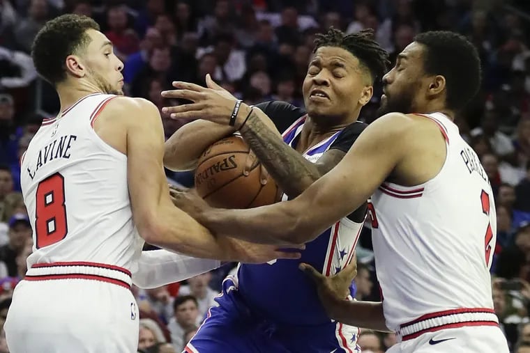 Sixers guard Markelle Fultz getting fouled while driving to the basket against the Bulls.