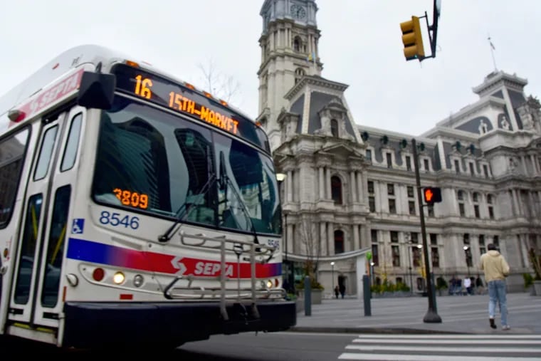 FILE PHOTO: A SEPTA bus passes in front of City Hall, turning onto 15th Street March 24, 2019.