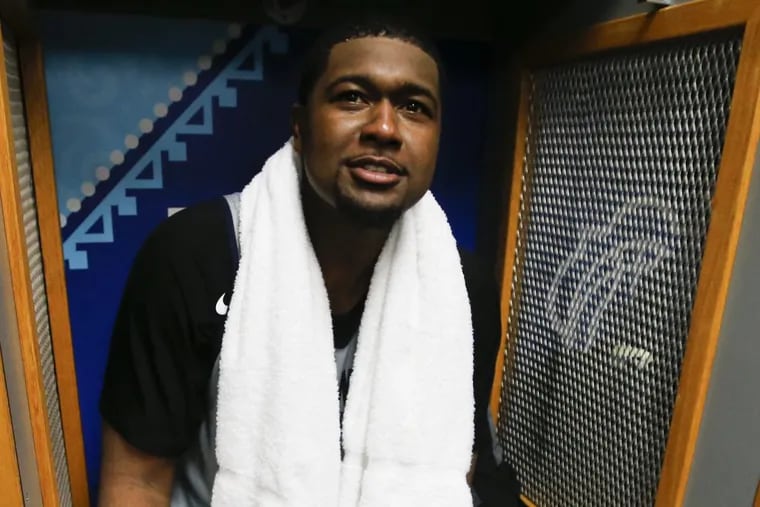 Former Villanova basketball player Kris Jenkins sits in a locker after practicing with the current team on Thursday in San Antonio.