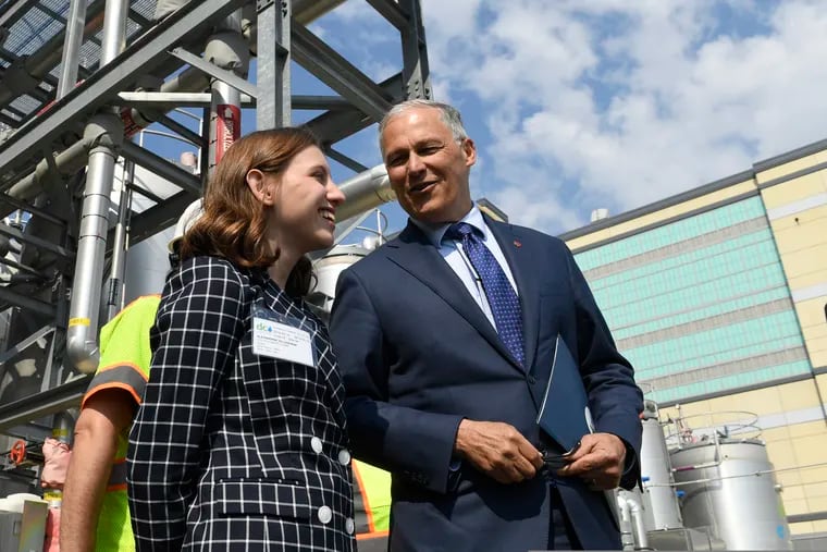 Democratic Presidential candidate Washington Gov. Jay Inslee, right, talks with then-13-year-old climate justice activist Alexandria Villaseñor, left, as he tours the Blue Plains Advanced Wastewater Treatment Plant in Washington, Thursday, May 16, 2019, during an event where he unveiled part of his plan to defeat climate change.