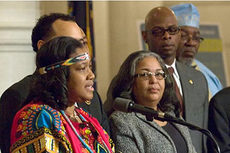 Pa. Rep. Vanesa Lowery Brown sports a traditional African outfit during a Black History Month celebration in Harrisburg on Feb. 13. Rep. W. Curtis Thomas (right, rear) was ignored by the General Assembly for his dashiki, which was considered a dress-code violation.