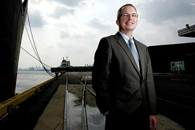 DRPA chairman John Estey, standing in the Tioga Marine Terminal. He announced Wednesday that he was stepping down in January. (David Swanson/File)