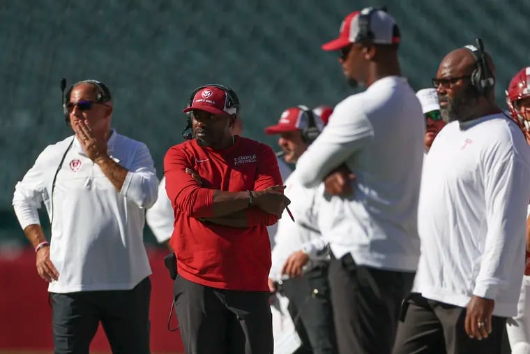 Temple Owls head coach Stan Drayton (center) and his coaching staff will hope to have a clearer picture of key roster spots following Saturday's annual Cherry and White spring football game at Edberg-Olson Field.