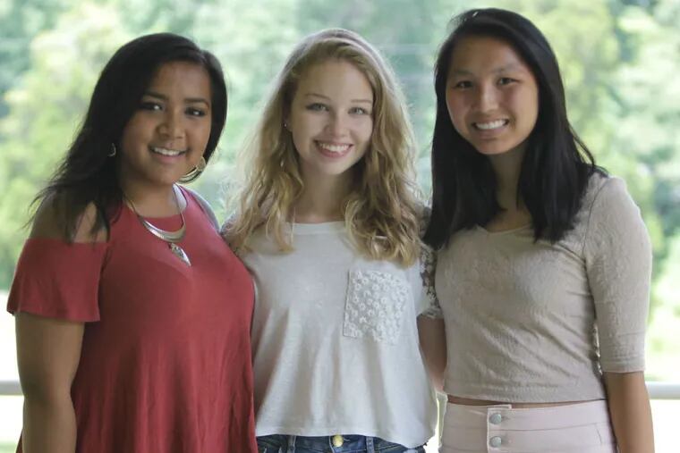 Deisha Brahma (from left), Isabella Black, and Lea Hawthorne are members of the Alice Paul Institute's Girls Advisory Council. They said they believe it's important to have a female candidate and that it could influence the next generation.