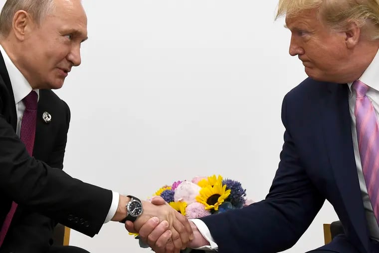 FILE - In this file photo taken on Friday, June 28, 2019, President Donald Trump, right, shakes hands with Russian President Vladimir Putin during a bilateral meeting on the sidelines of the G-20 summit in Osaka, Japan. From Moscow, the U.S. election looks like a contest between "who dislikes Russia most," according to Kremlin spokesman Dmitry Peskov. Russian President Vladimir Putin is frustrated with President Donald Trump's failure to deliver on his promise to fix ties between the countries. But Democratic challenger Joe Biden does not offer the Kremlin much hope either. (AP Photo/Susan Walsh, File)