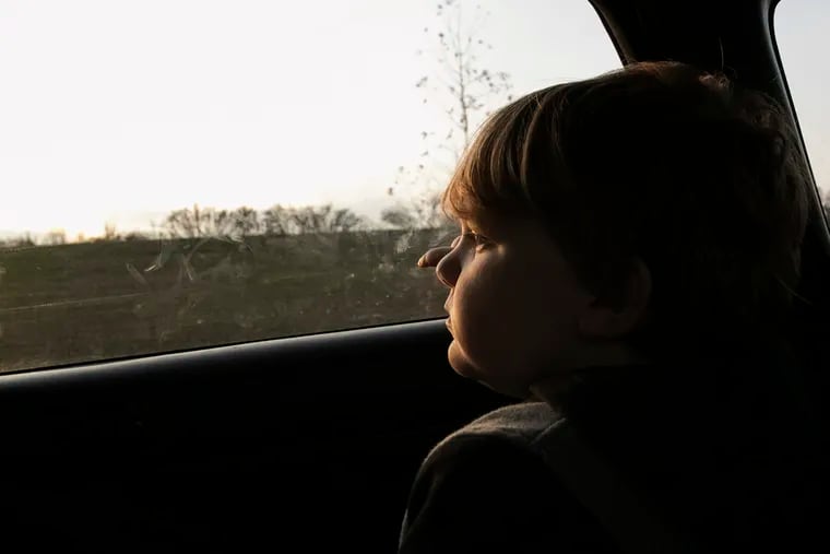 J.J. Borgesi, 12, looks out of the car window as he and his mom take their daily afternoon drive to look for housing around the Bridgeport area. Amy Hylenski and her son were displaced after the flooding from Ida and are living with her mother until they can find an affordable home.
