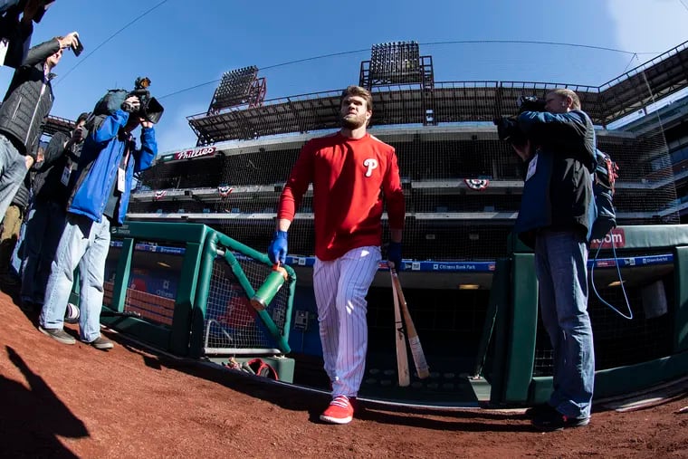 Philadelphia Phillies' Bryce Harper comes out of the dugout  for batting practice, during baseball workout at Citizens Bank Park. Tuesday, March 26, 2019, in Philadelphia.