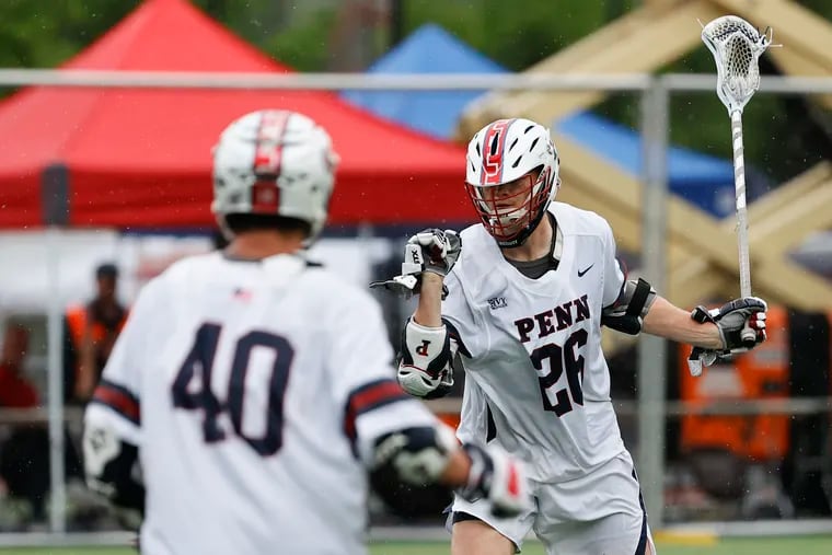 Penn's Sam Handley (right) celebrates his third period goal with teammate Dylan Gergar against Richmond during the first round of the NCAA men's lacrosse Ccampionship on May 14. The Quakers lost to Rutgers on Saturday.