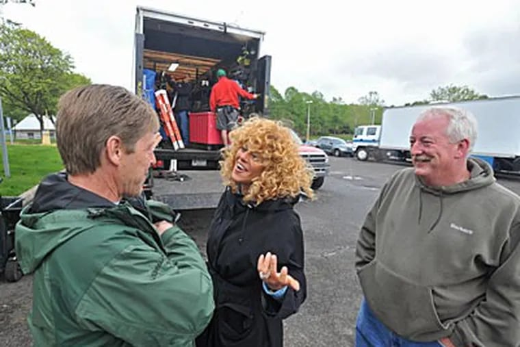 Greater Philadelphia Film Office executive director Sharon Pinkenson (center) shares a laugh with local union film production workers Bill Fiedler (left), best boy electric on the production of the movie Happy Tears, and Dan Reddy, craft services. (Clem Murray / Staff )