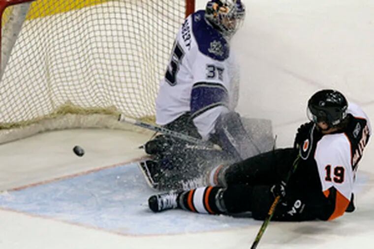 The Flyers&#0039; Scott Hartnell nets the game-winner in overtime on the Kings&#0039; Jason LaBarbera. The goal was reviewed and allowed to stand.