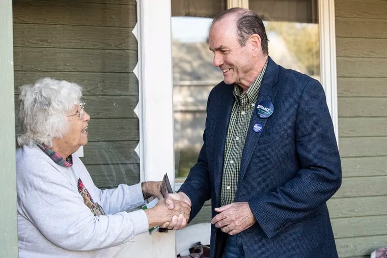 Scott Wallace, Democratic candidate for U.S House in First District, talks to Naomi T. Judge outsider he home in Levittown, Pa. Tuesday, October 29, 2018.