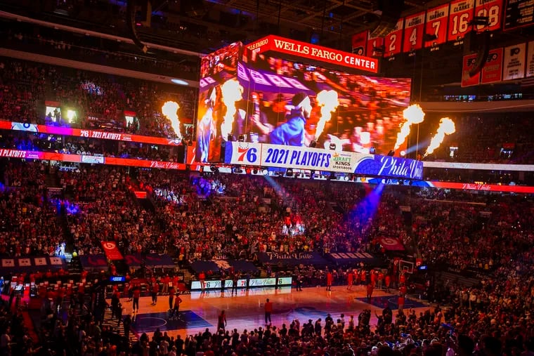 The fan experience at a 76ers game at the Wells Fargo Center includes dramatic player introductions.