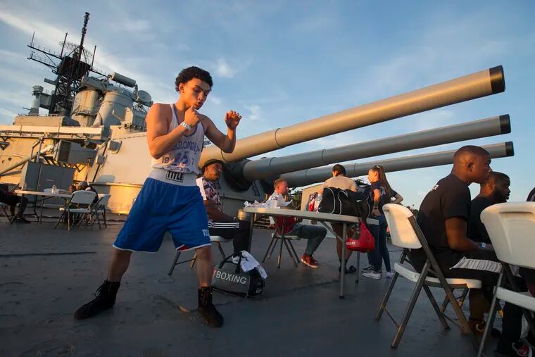 An amateur boxing event, Battle on the Battleship, was held on the Battleship USS New Jersey to raise funds for a recently commissioned statute of Camden boxing legend Jersey Joe Walcott on Sept. 27, 2019.   Dominic Bevins of Philadelphia warms-up doing some shadow boxing on the deck.