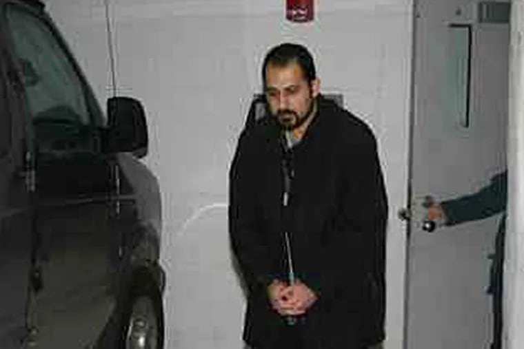 Iranian arms broker Amir Ardebili in U.S. custody. (U.S. government photograph, obtained by The Inquirer)