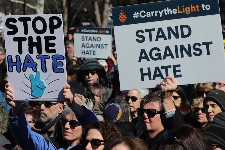 Demonstrators participate in the &quot;Stand Against Hate&quot; rally near Independence Mall.