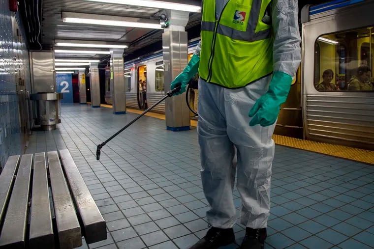 SEPTA maintenance workers clean the benches in the Market-Frankford Line's Second Street Station. The workers were in the station to demonstrate how they clean the subways, which is normally done at night after the stations close.