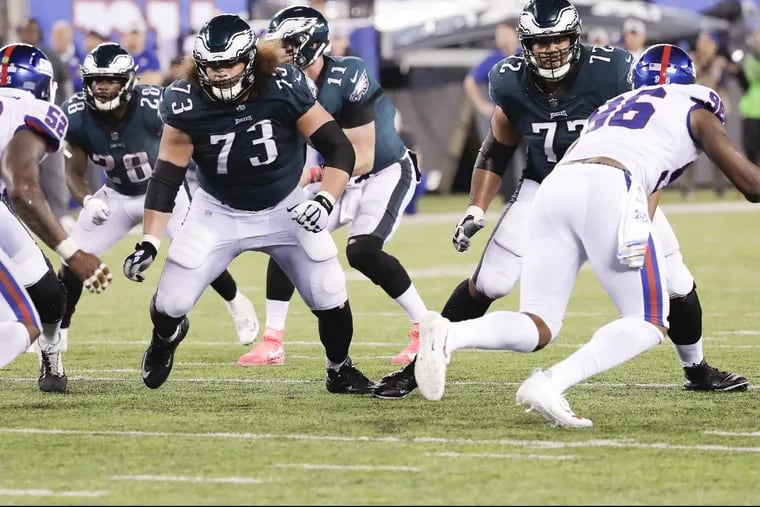 Eagles offensive guard Isaac Seumalo and Eagles offensive tackle Halapoulivaati Vaitai prepare to block New York Giants defenders on Thursday, October 11, 2018 in East Rutherford, NJ. YONG KIM / Staff Photographer