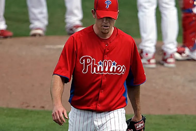 A sore elbow sent Brad Lidge back to Philadelphia for a visit with team doctor Michael Ciccotti. (David Maialetti/Staff file photo)