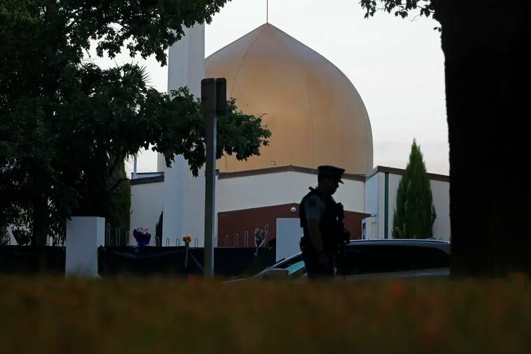 In this March 17, 2019, file photo, a police officer stands guard in front of the Al Noor mosque in Christchurch, New Zealand.