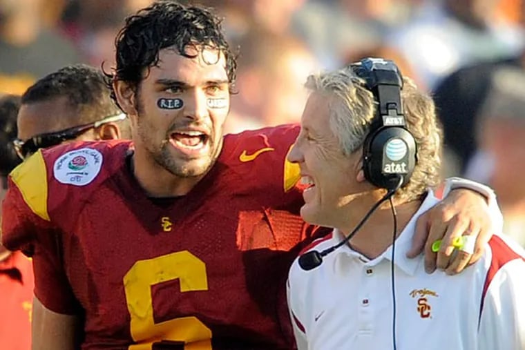 Mark Sanchez, left, and coach Pete Carroll talk on the sideline during the second quarter of the Rose Bowl NCAA college football game against Penn State in Pasadena, Calif., Thursday, Jan. 1, 2009. (Chris Carlson/AP)