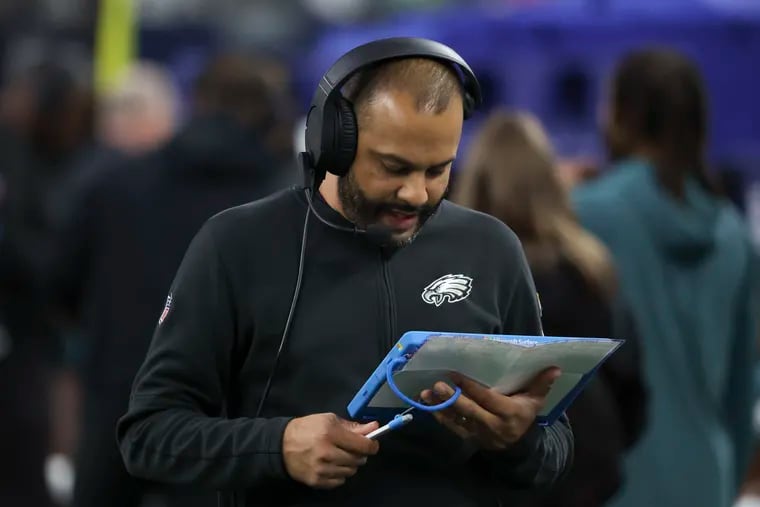 Eagles defensive coordinator Sean Desai looking at his tablet after the Cowboys took a 10-0 lead at AT&T Stadium on Sunday night.