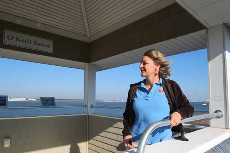 The New Jersey Audubon Society plans to permanently close Rancocas Nature Center in Burlington County and reduce the months that Nature Center of Cape May are open to the public. Audubon says it's responding to budgetary and funding contraints.  Nature Center of Cape May Director Gretchen Whitman looks out over the Cape May Harbour from the Center's O'Neill Tower.   ( Charles Fox / Staff Photographer )