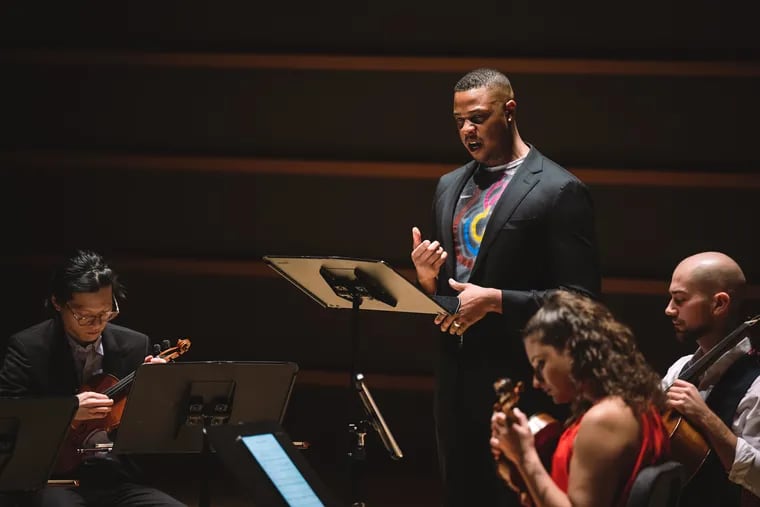 Bass-baritone Davóne Tines performing Caroline Shaw's "By and By" with the Dover Quartet, Nov. 5, 2021, in the Kimmel Center's Perelman Theater.