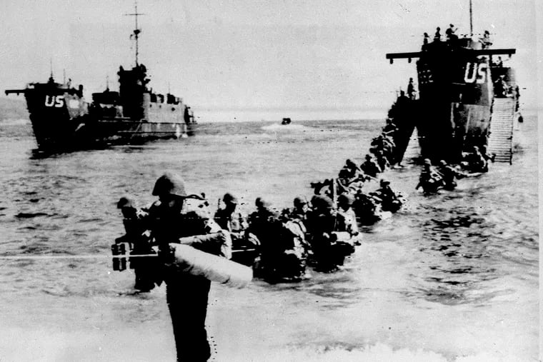 FILE - In this Aug 16, 1944 file photo, American and allied troops wade through the water from a LST (Landing Ship Tank) on an unidentified beach, east of Toulon, southern French riviera, as part of Operation Dragoon. Carried out by French and American troops, it started on August 15, 1944. In total, 350,000 French and American troops landed on the French Riviera. For Allied troops in western Europe, D-Day was just the beginning of a long and bloody push toward victory over the Nazis. Ten weeks after commemorating the 75th anniversary of the D-Day invasion in Normandy, France is paying tribute this week to Allied troops involved in another major, but often overlooked, military operation: landings on the Mediterranean coast. (AP Photo, file)