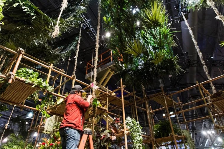 A mass of plants and flowers is set up on Wednesday morning, Feb. 28, 2018, for the Philadelphia Flower Show at the Pennsylvania Convention Center.