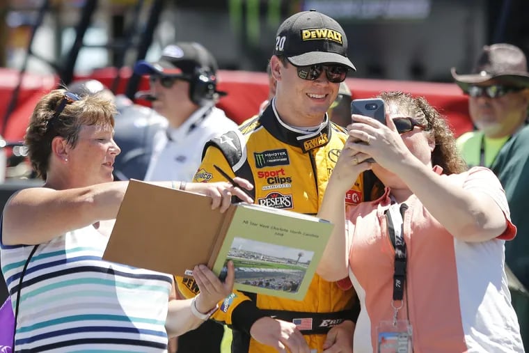 Erik Jones posing for a selfie with a fan before a practice earlier this summer.