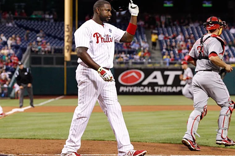 Ryan Howard takes his helmet off after striking out to the third inning of a baseball game against the Cincinnati Reds, Friday, May 16, 2014, in Philadelphia. The Reds won 3-0. (Chris Szagola/AP)