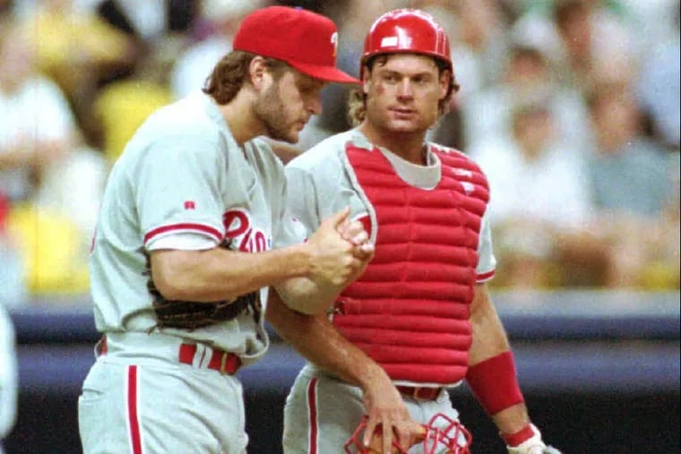 Former Phillies pitcher Tommy Greene is met on the mound by Darren Daulton during the team's 1993 run.