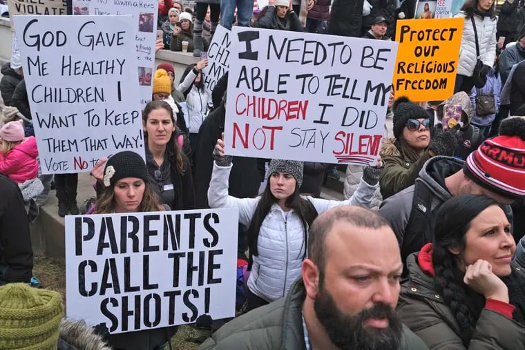 After opponents of school vaccine requirements protested outside the Statehouse in Trenton, N.J., on Jan. 13, 2020, lawmakers canceled a vote to eliminate religious exemptions from vaccines.