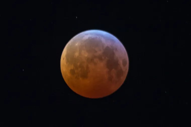 The "blood moon" lunar eclipse as seen from the East Falls section of Philadelphia early Monday morning.