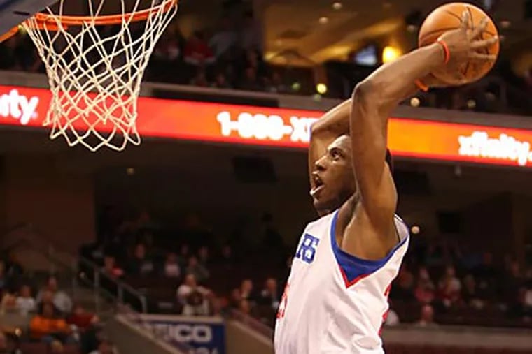 Thad Young goes up for a dunk during the Sixers' win over the Bobcats on Friday night. (Steven M. Falk/Staff Photographer)