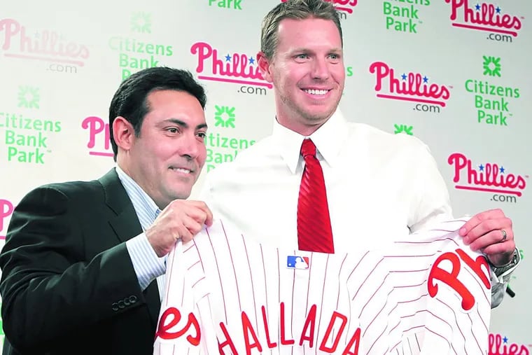 Ruben Amaro with Roy Halladay after the Phillies completed a December 2009 trade for the righthander.