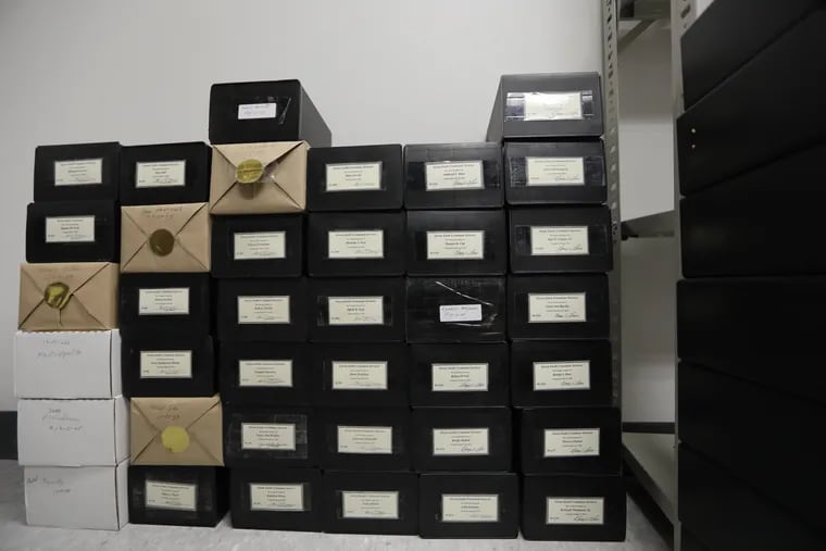 Inside these small plastic boxes, inside a storage closet at the Chester County Coroner's Office, have languished the cremated remains of dozens of people. After years in limbo, these souls are finally being interred, thanks to two women who would have it no other way.