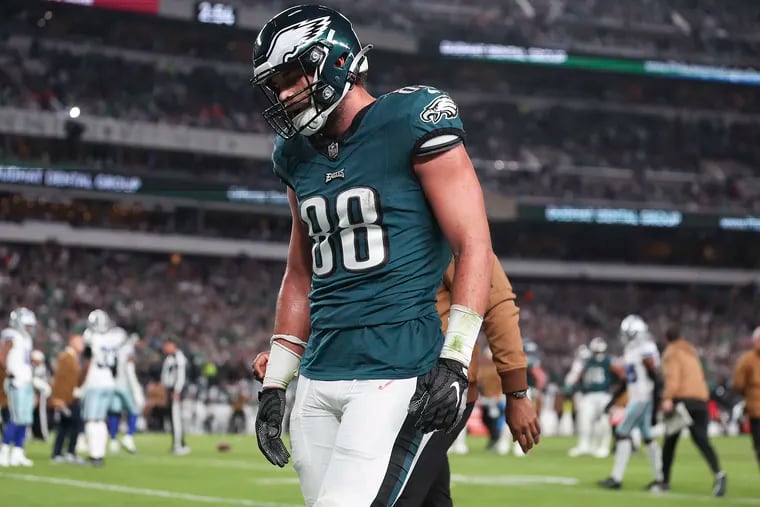 Eagles tight end Dallas Goedert leaves the field after getting injured against the Dallas Cowboys in the third quarter on Sunday.