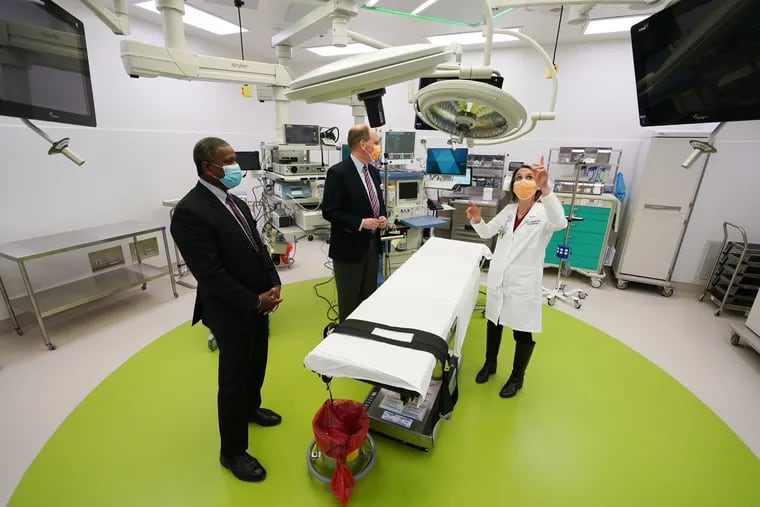 (Left to Right) Donald E. Moore, Senior Vice President of Real Estate, Facilities and Operations, Jan Boswinkel, Senior Vice President and Chief Operating Officer at Children's Hospital of Philadelphia in King of Prussia, and Allison Ballantine, Associate Chief Medical Officer at Children's Hospital of Philadelphia in King of Prussia, shown here in one of the operating rooms during a tour of CHOP's new hospital in King of Prussia, PA, Friday, January 21, 2022.