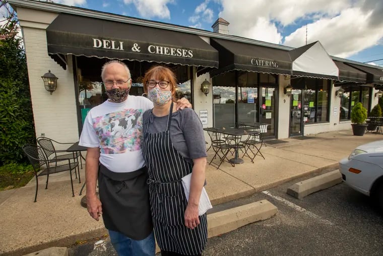 Larry and Roxane Maggio outside Ludovico's Deli in Haddonfield, which they have closed after 10 years because of a labor shortage.