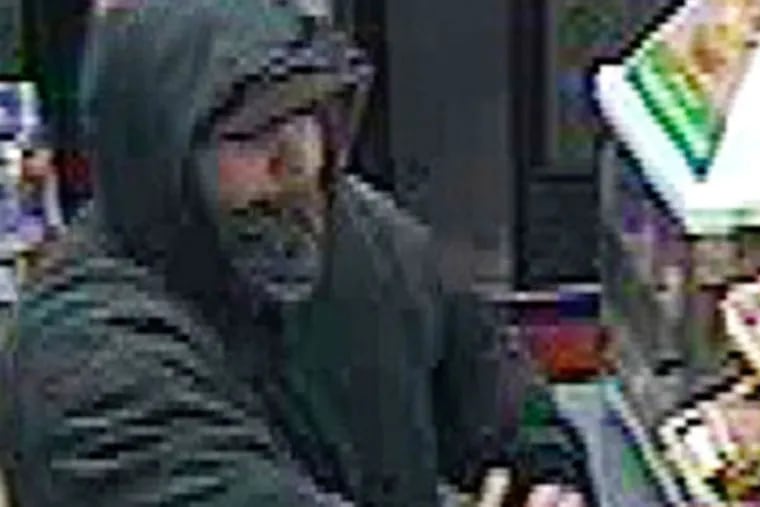 Alleged serial robber stealing from a 7-Eleven in the Northeast, caught in a video. He stole $200 from the store on Rising Sun Ave.