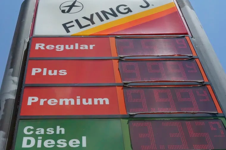 FILE- This June 14, 2018, file photo shows signage and gas prices for regular and diesel at Flying J along Interstate 85 and 40 near Graham, N.C. The average U.S. price of regular-grade gasoline is up a dime a gallon (3.8 liters) over the past two weeks. (AP Photo/Gerry Broome, File)